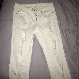 white ripped button up jeans